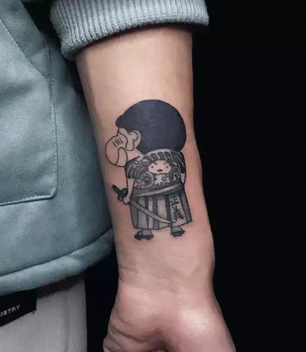 Small chibi samurai temporary tattoo with justice banner placed on the wrist